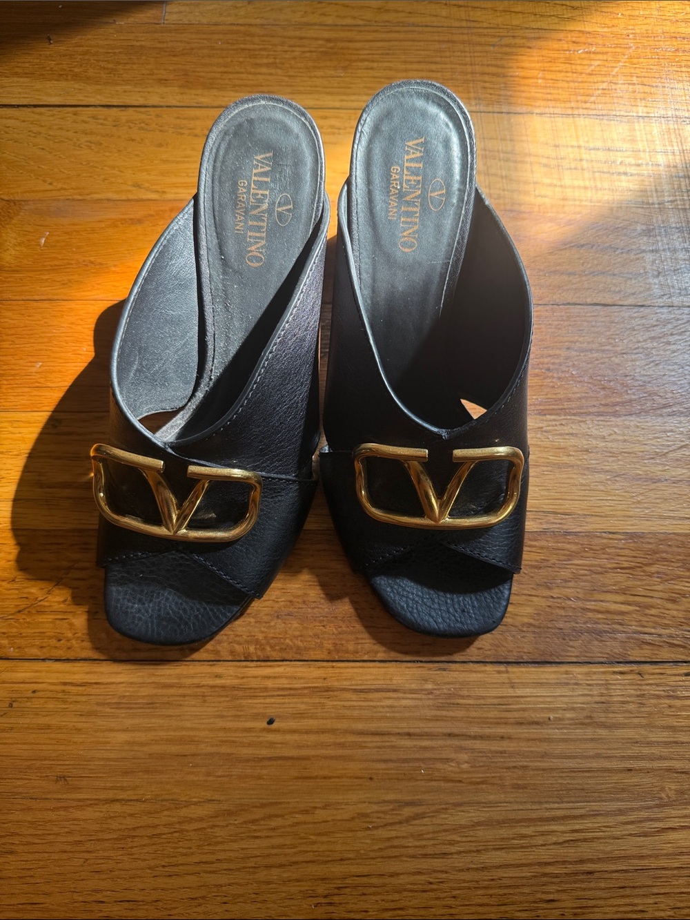 Valentino Garavani Black Leather Slide Mules with Gold V Buckle